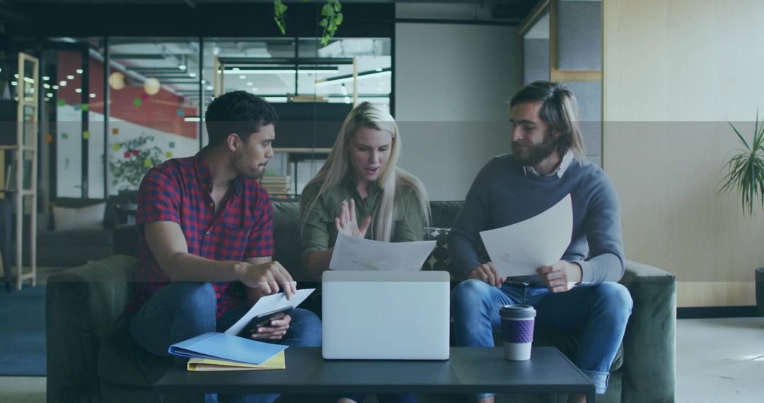 Team Collaboration and Document Review in Modern Office Lounge