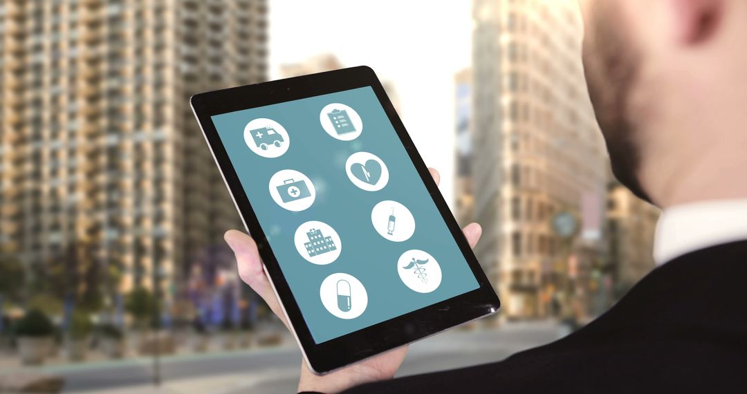 Businessman Exploring Health Apps on Tablet in Urban Setting