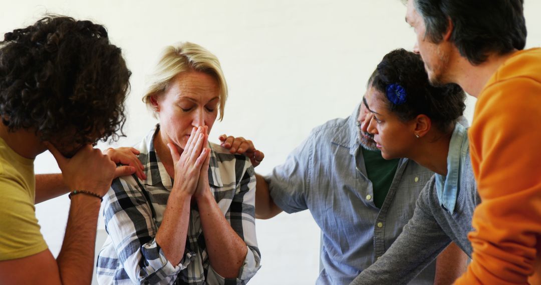 Supportive Group Comforting Distressed Woman with Compassion
