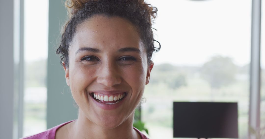 Smiling Professional Woman in Bright Office Environment