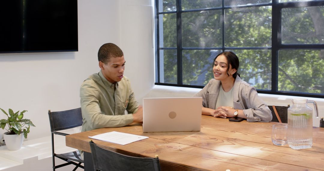 Business Colleagues Discussing Project in Modern Office Meeting Room