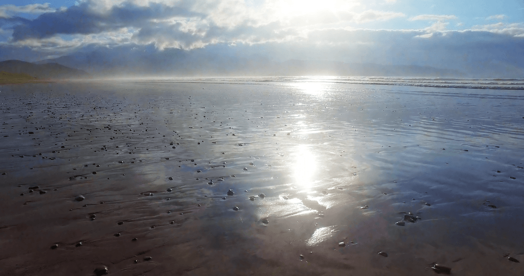 Transparent Sunlight Reflecting on Tranquil Seashore Horizon