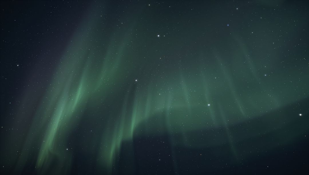 Glowing green aurora curtains sweeping across polar night sky with starry cosmic expanse