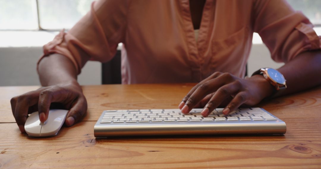 Professional Woman Typing on Keyboard in Office