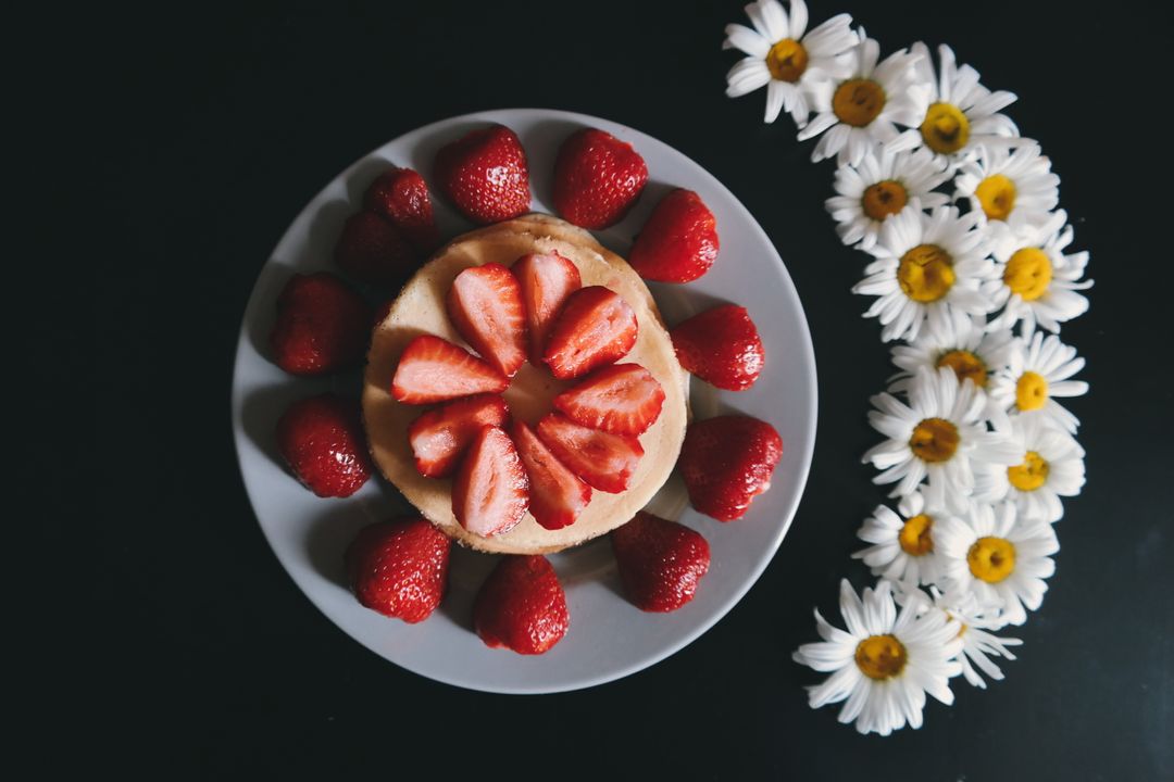 Artistic Arrangement of Strawberry Cake with Daisies