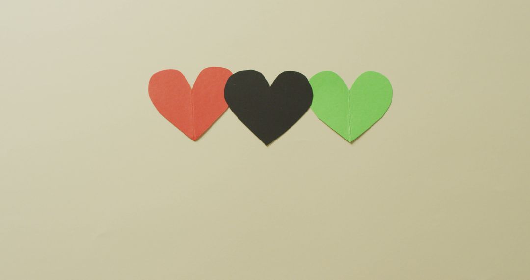 Image of red, black and green paper hearts on beige background - Free Images, Stock Photos and Pictures on Pikwizard.com