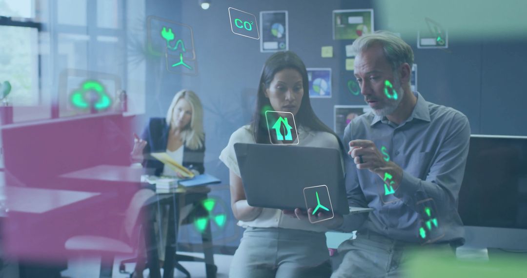 Ecology Icons with Colleagues Collaborating on Laptop in Office