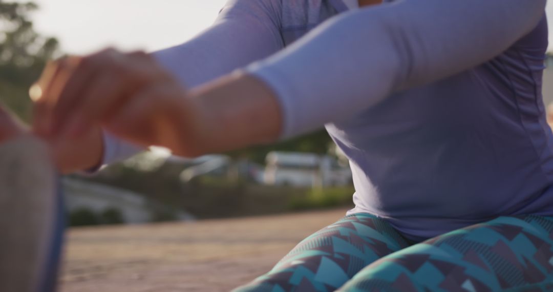 Woman Stretching Outdoors in Activewear at Sunset - Free Images, Stock Photos and Pictures on Pikwizard.com