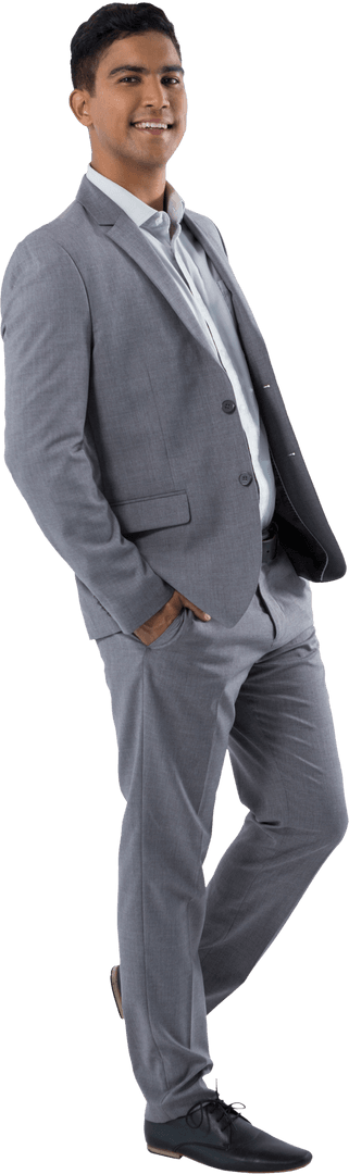 Confident Young Businessman Standing in Gray Suit with Hands in Pockets