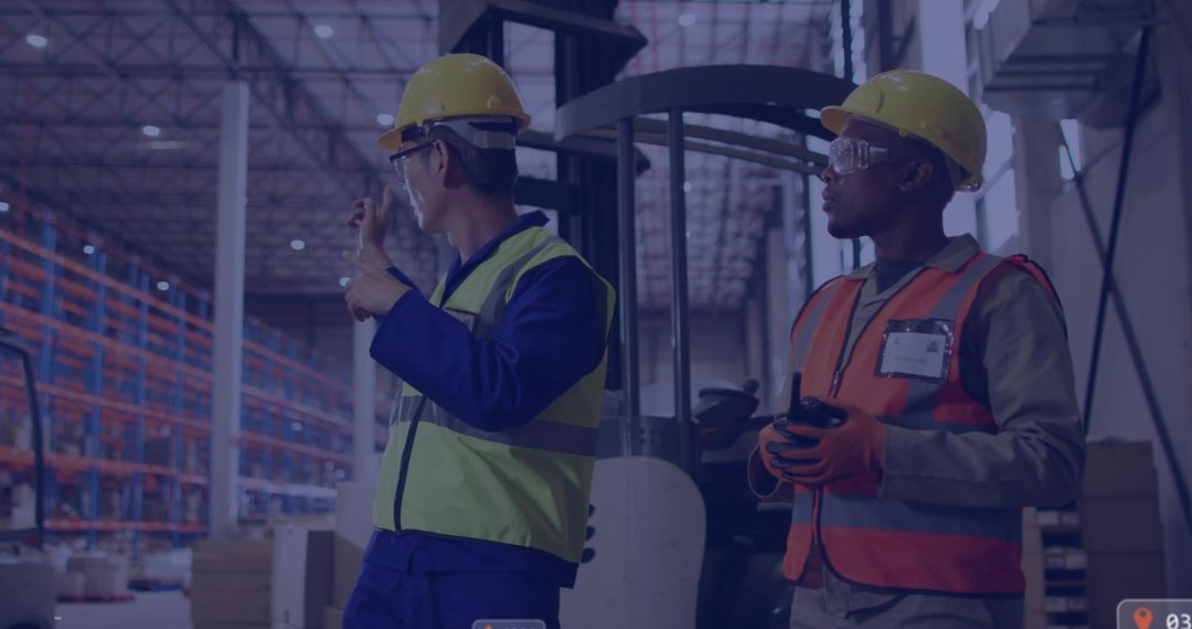Warehouse workers pointing and inspecting inventory near forklift with scanner and radio