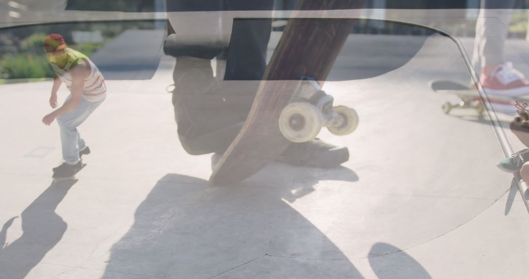 Skateboarding Enthusiasts in Action at Sunny Skate Park