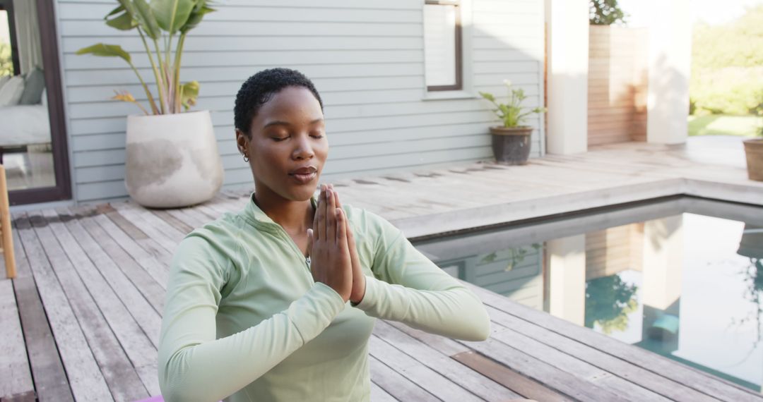 Woman Meditating by Pool in Outdoor Yoga Practice - Free Images, Stock Photos and Pictures on Pikwizard.com