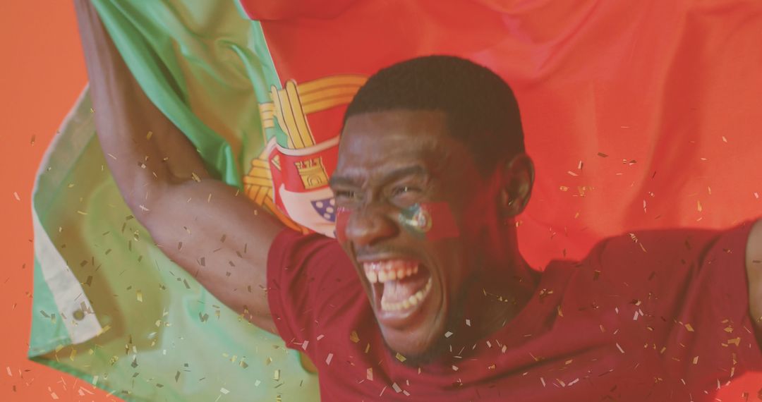 Passionate Soccer Fan Celebrating Victory with Portugal Flag - Free Images, Stock Photos and Pictures on Pikwizard.com