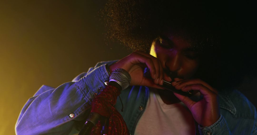 African American Musician Playing Harmonica on Stage - Free Images, Stock Photos and Pictures on Pikwizard.com