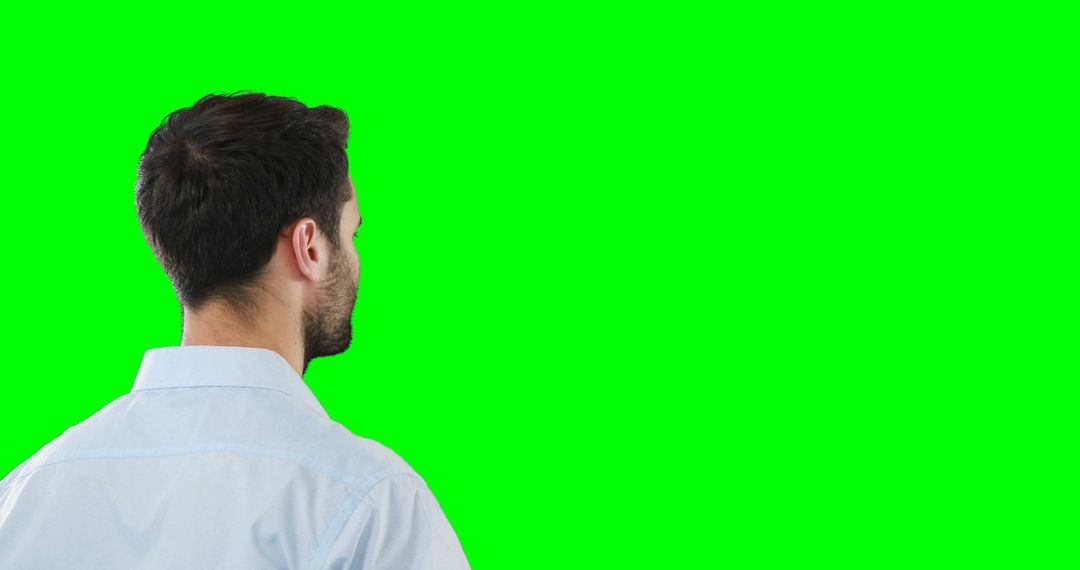 Man Facing Blank Green Screen for Editing