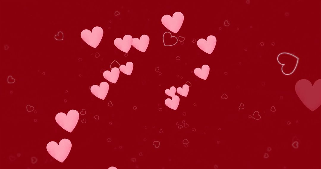 Pink Hearts Scattered on Bold Red Background Celebrating Love