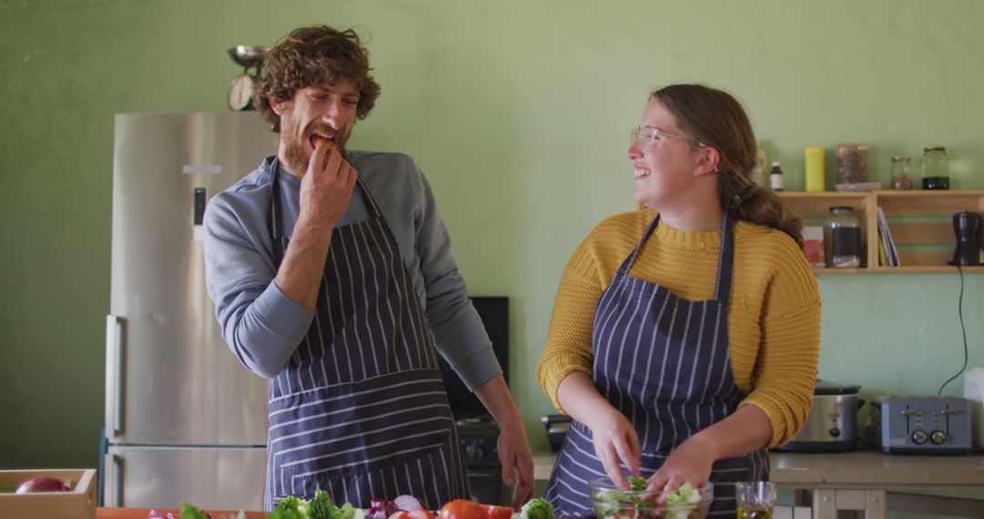 Joyful Couple Bonding Over Cooking in Rustic Kitchen