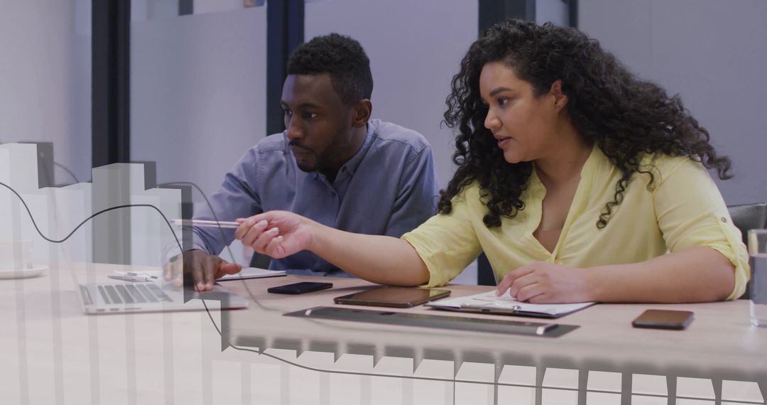 Diverse Colleagues Analyzing Financial Data Together in Modern Workspace