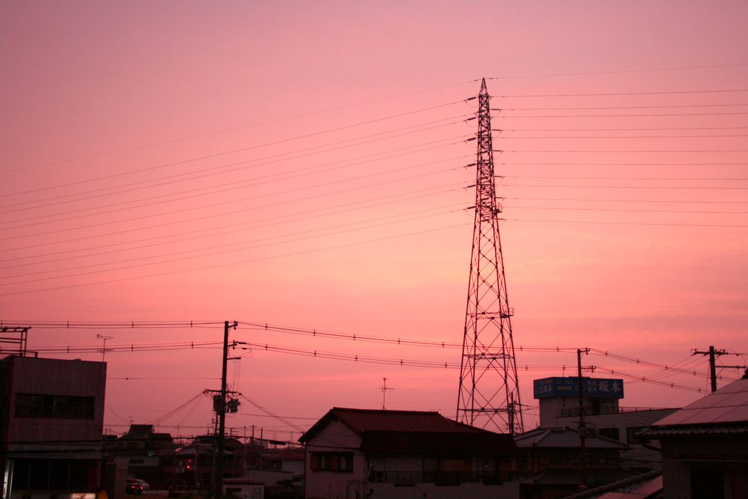 City Skyline with Transmission Tower during Pink Sunset - Free Images, Stock Photos and Pictures on Pikwizard.com