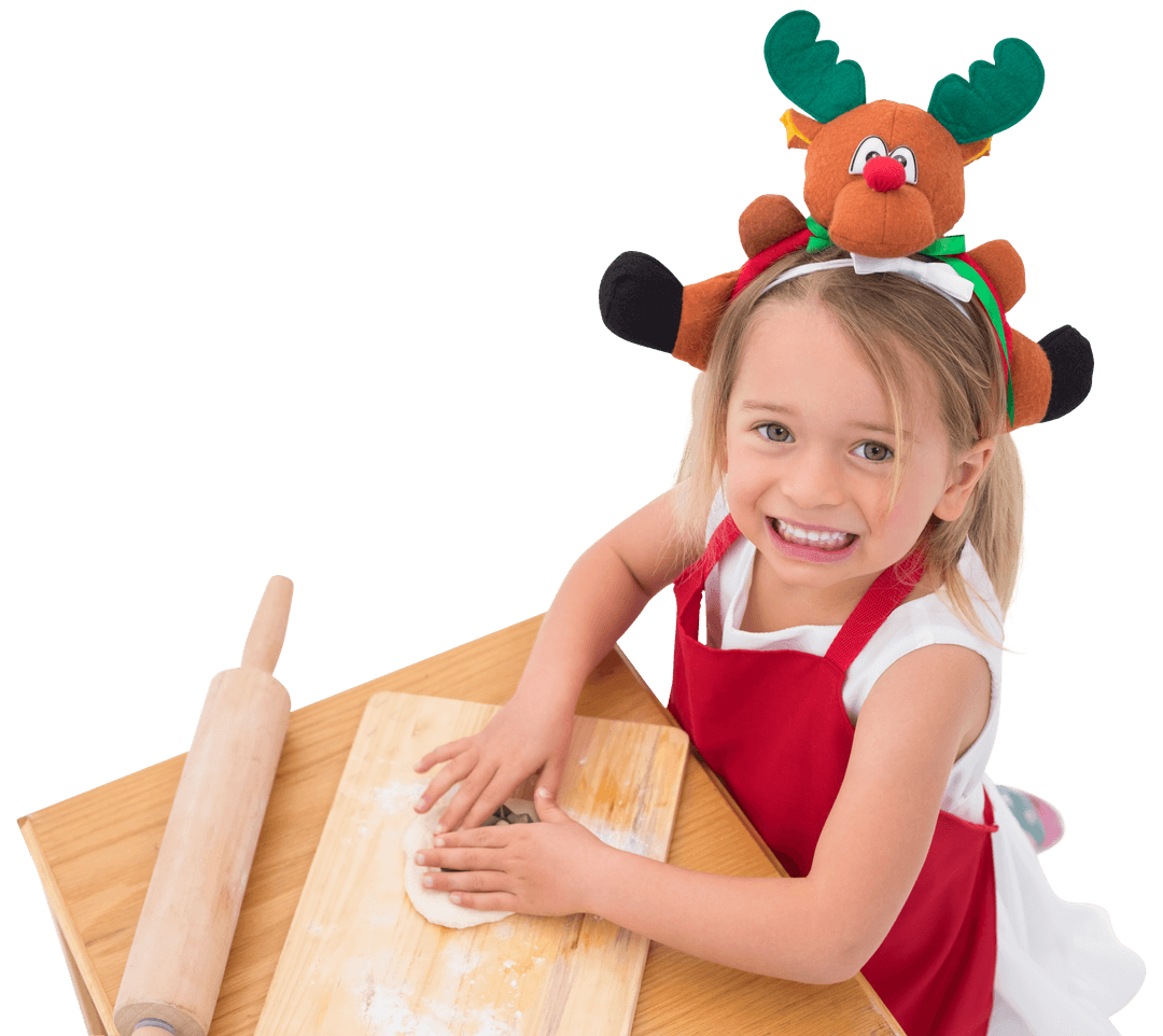 Little Girl Preparing Holiday Cookies with Reindeer Headband Transparent
