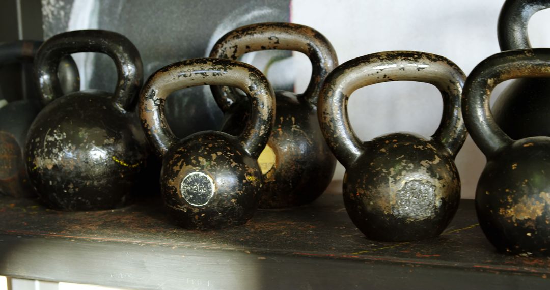 Aged Kettlebells on Rustic Shelf in Gym - Free Images, Stock Photos and Pictures on Pikwizard.com