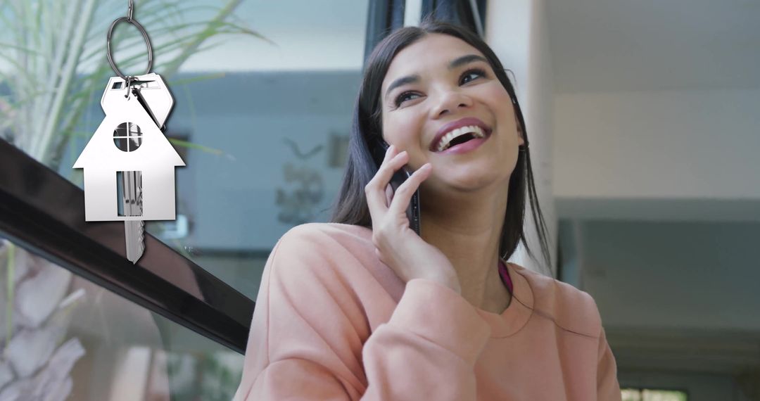 Joyful Woman Discussing New Home While Calling Phone