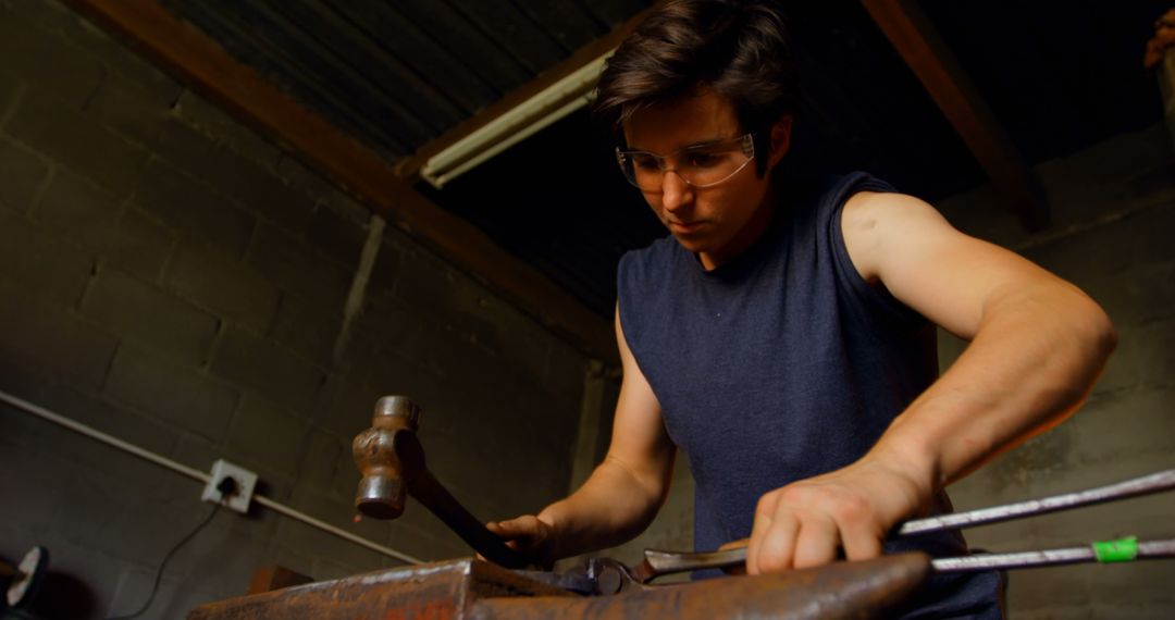 Young Carpenter Wearing Safety Glasses Working on Wood - Free Images, Stock Photos and Pictures on Pikwizard.com