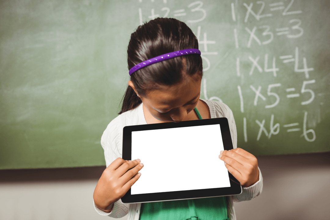 Young Girl Engaged with Tablet Learning in Classroom Setting