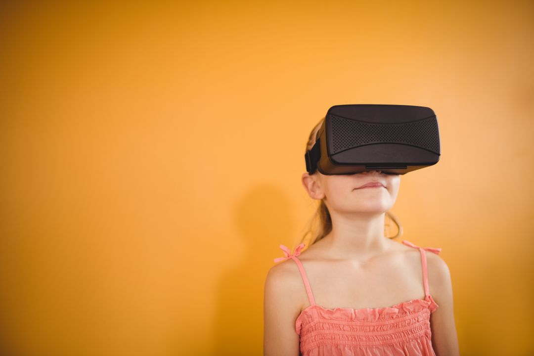 Girl using a virtual reality device - Free Images, Stock Photos and Pictures on Pikwizard.com