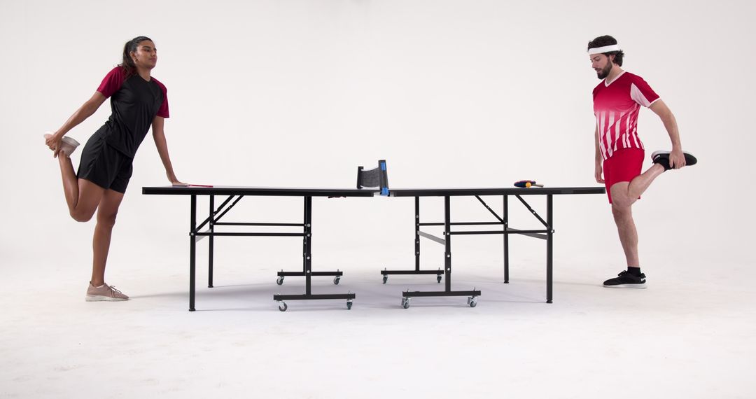 Multicultural Table Tennis Athletes Warming Up in Studio