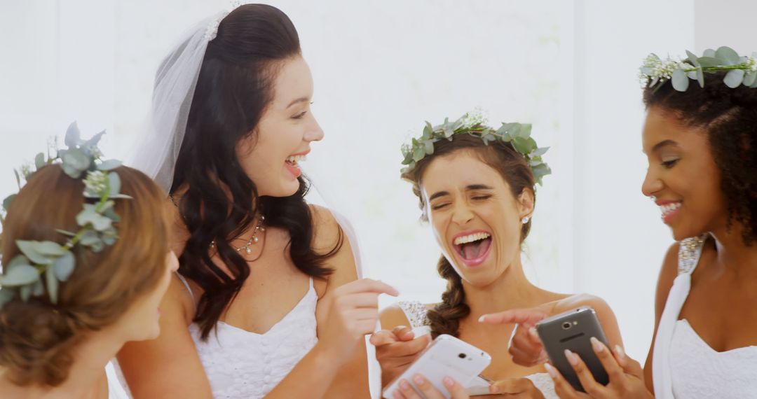 Bride and bridesmaids using smartphones and celebrating - Free Images, Stock Photos and Pictures on Pikwizard.com