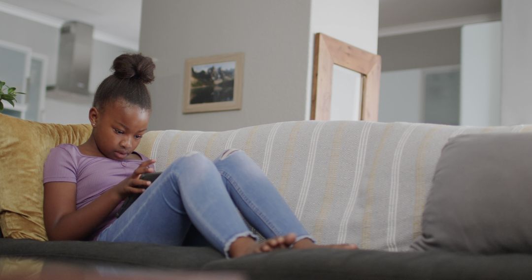 Young Girl Relaxing on Couch Using Smartphone - Free Images, Stock Photos and Pictures on Pikwizard.com