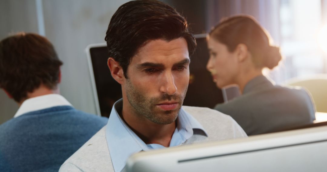 Focused Business Executive Working on Computer in Office