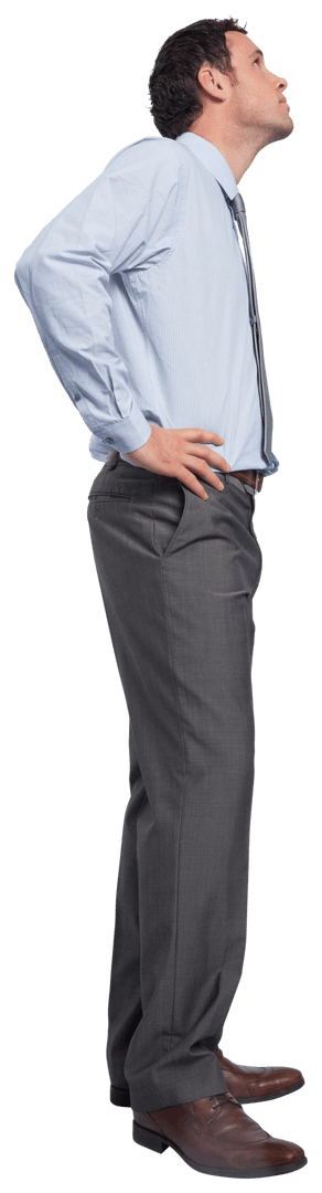 Confident Businessman Gazing Upward with Hands on Hips Transparent
