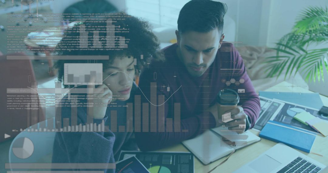 Collaborating on data analytics dashboard at home office, studying charts on laptop