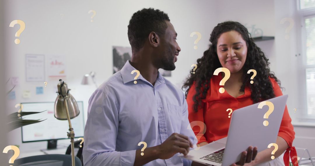 Colleagues Brainstorming with Technology in an Office Environment