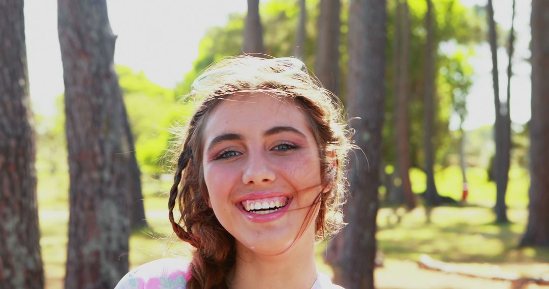 Outdoor Portrait of Smiling Young Woman in Nature - Free Images, Stock Photos and Pictures on Pikwizard.com