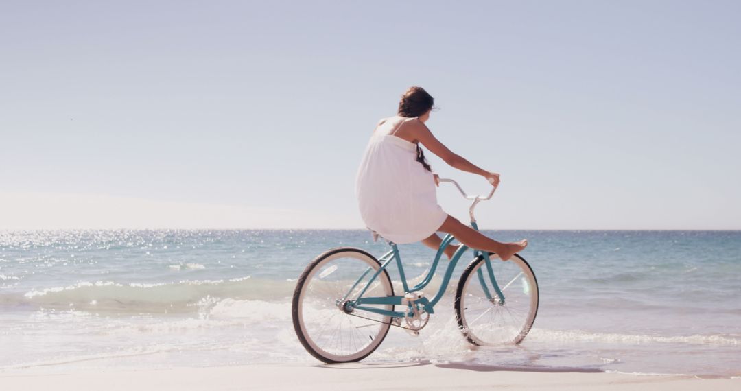 Woman Enjoying Summer With Bicycle on Beach - Free Images, Stock Photos and Pictures on Pikwizard.com