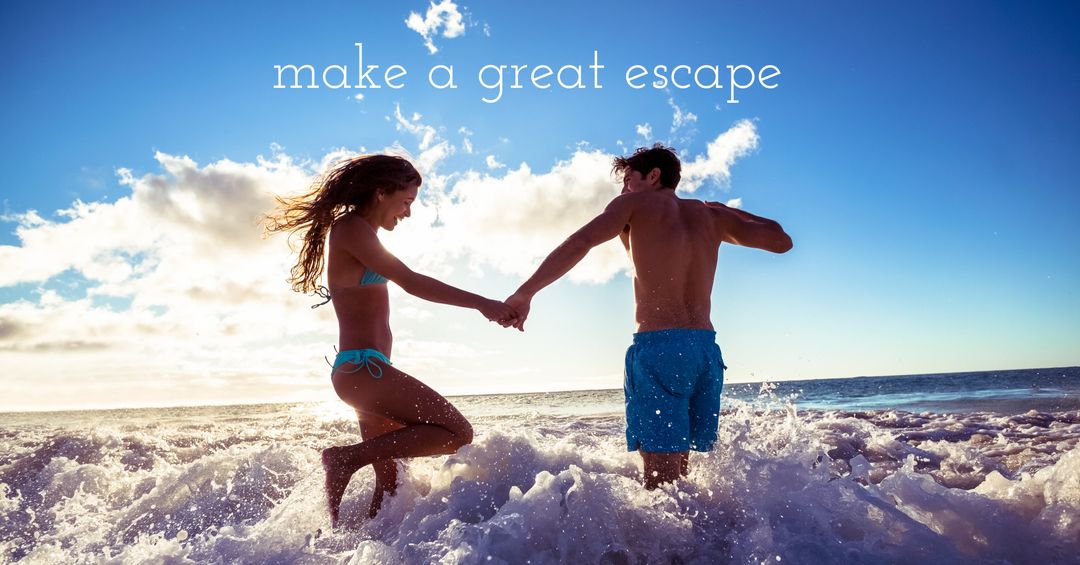 Joyful Couple Embracing Adventure in Ocean Waves