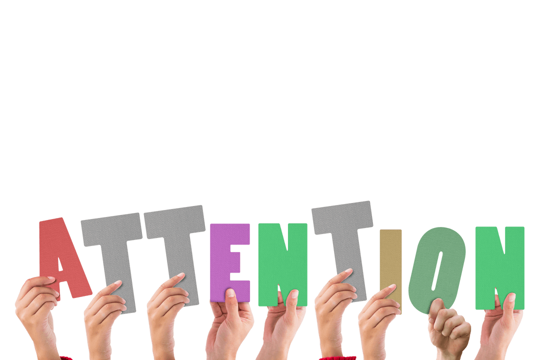 Hands Holding Colorful Transparent Letters Forming ATTENTION