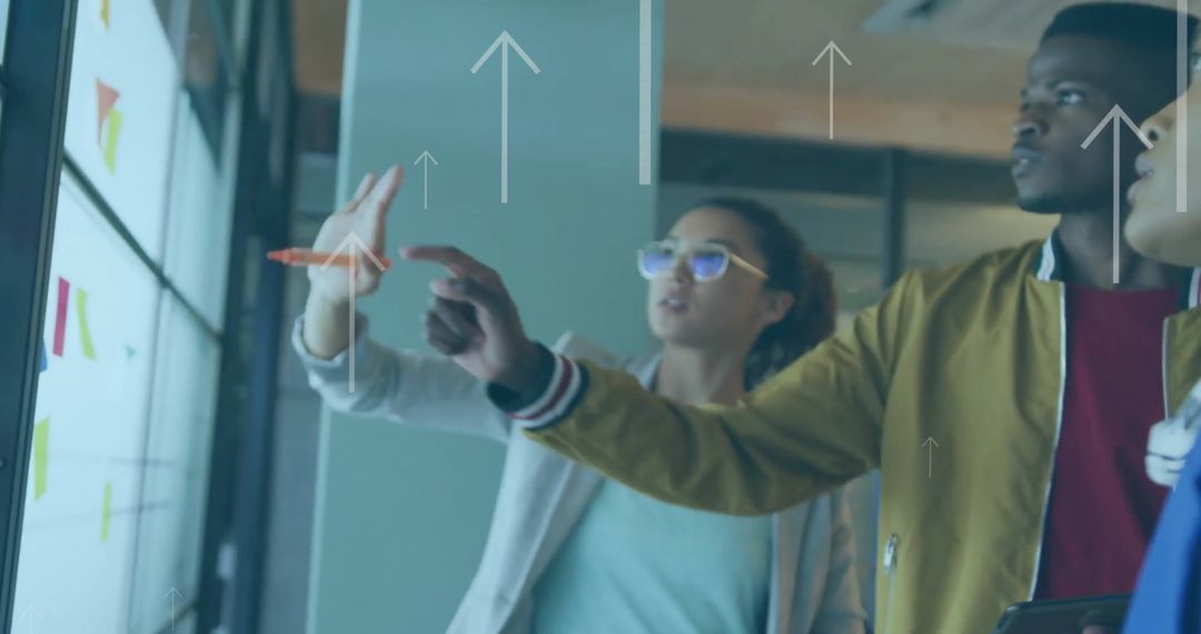 Diverse Professionals Analyzing Data on Digital Screen