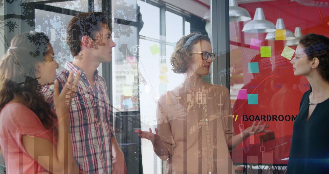 Diverse Team Discussing Projects with Digital Data Overlay