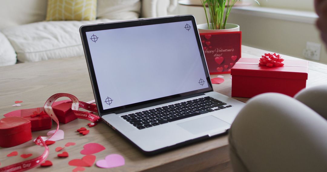Romantic Valentine's Video Call Setup with Laptop and Heart Decor