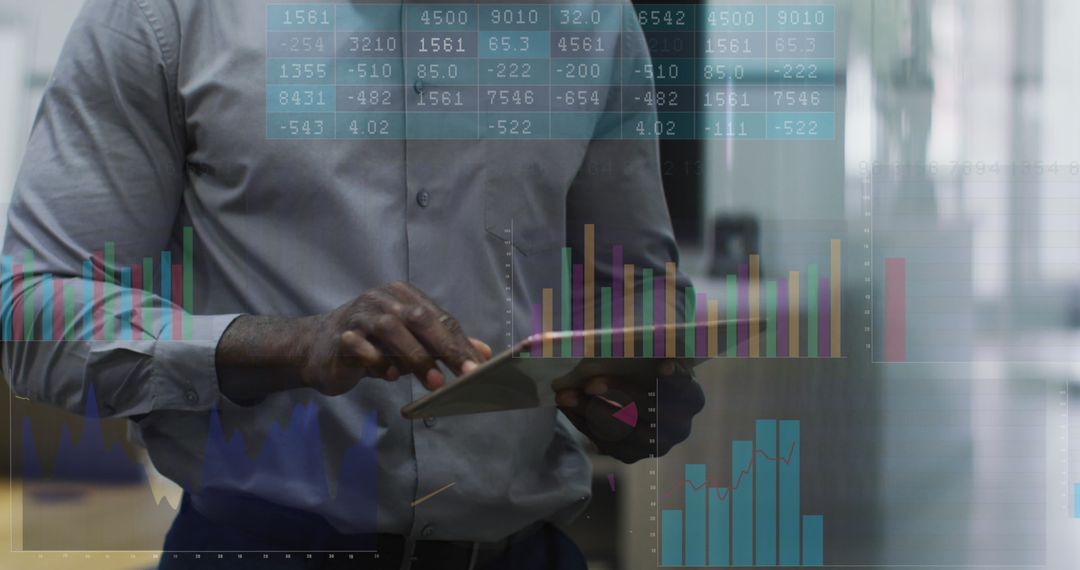 Businessman Analyzing Graphs on Tablet in Futuristic Office