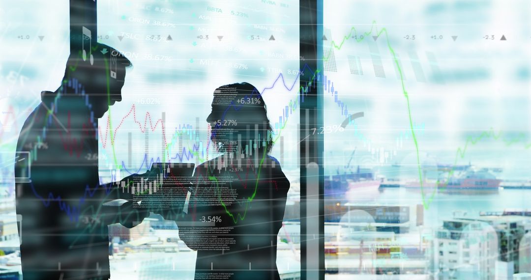 Silhouettes of Business Professionals Analyzing Financial Data