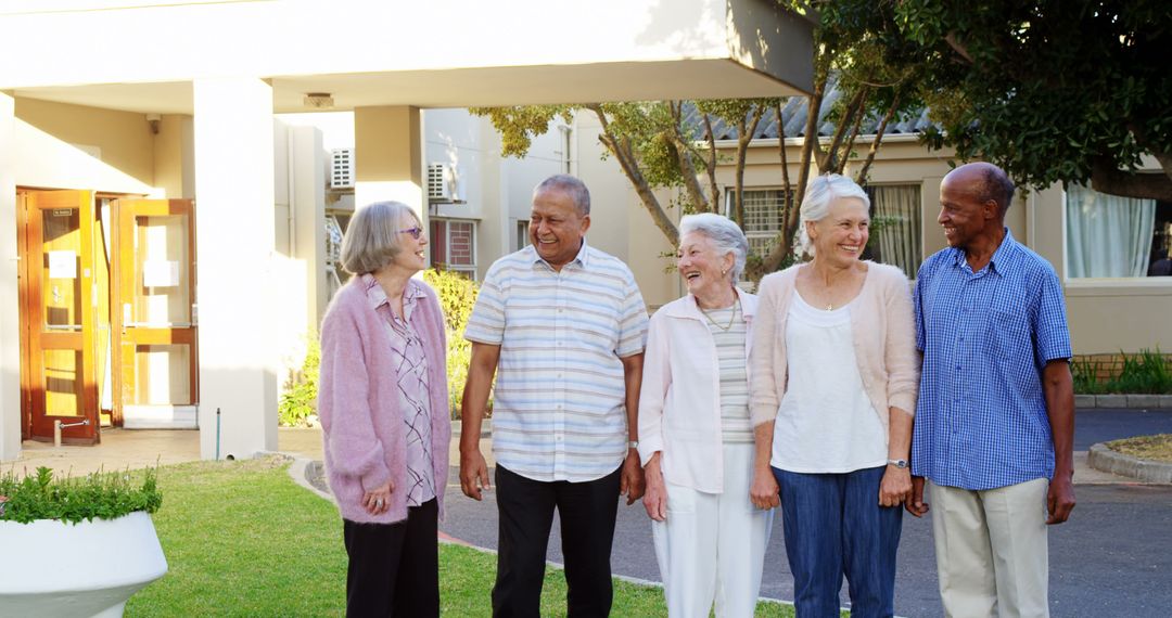 Senior Friends Laughing Outdoors at Community Center - Free Images, Stock Photos and Pictures on Pikwizard.com