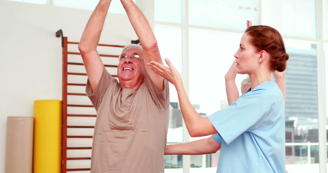 Physical Therapist Assisting Senior Man During Rehab Exercises - Free Images, Stock Photos and Pictures on Pikwizard.com