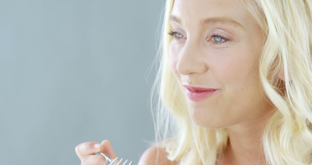 Young Woman Buoyant Expression While Eating - Free Images, Stock Photos and Pictures on Pikwizard.com