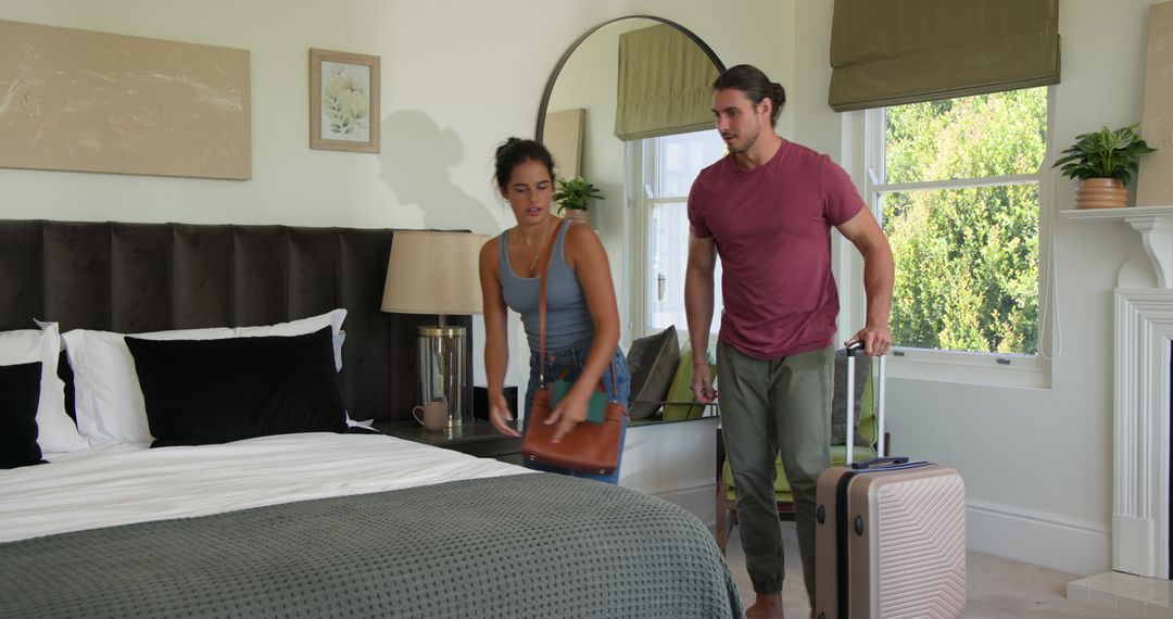 Couple Unpacking in Cozy Bedroom for Romantic Vacation