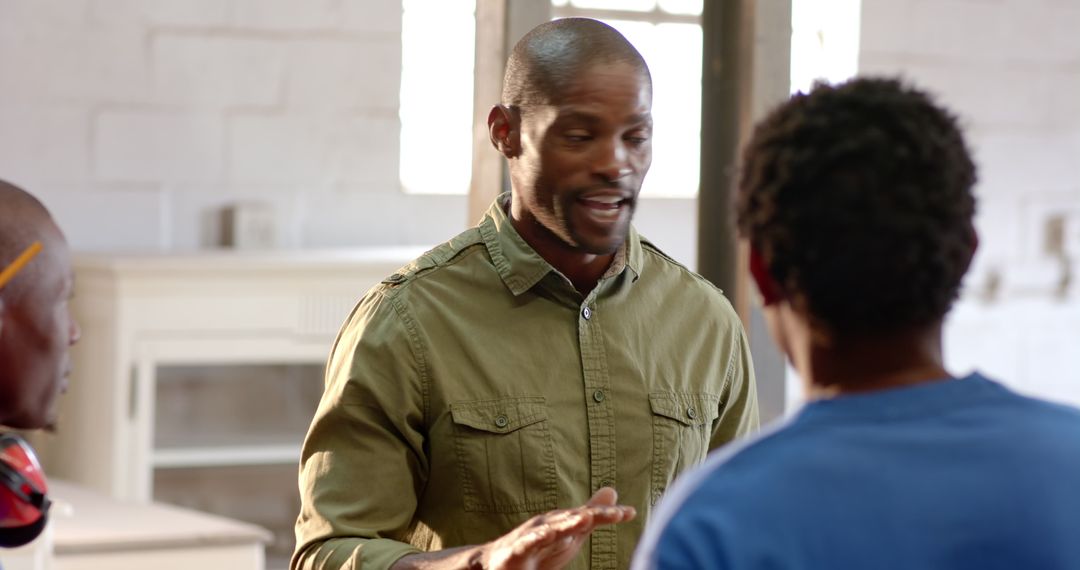 Mentor Guides Apprentices in Workshop Setting